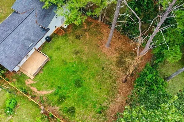 a view of yard from a backyard
