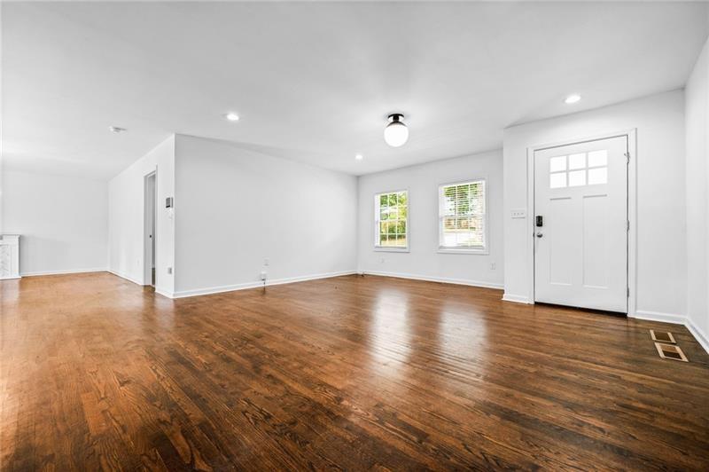 3089 Del Monico Drive Decatur, GA 30032 - Photo 7 of 47 an empty room with wooden floor and windows