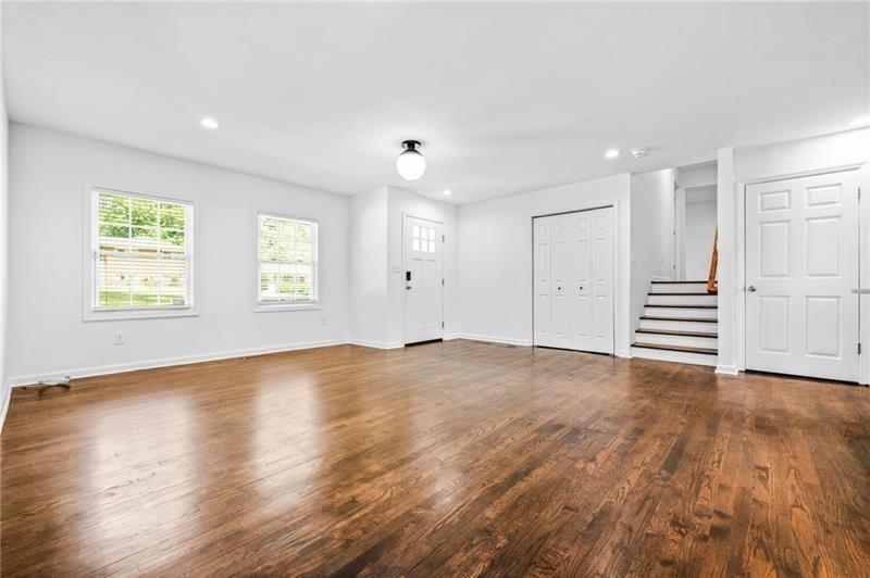 3089 Del Monico Drive Decatur, GA 30032 - Photo 9 of 47 an empty room with wooden floor and windows