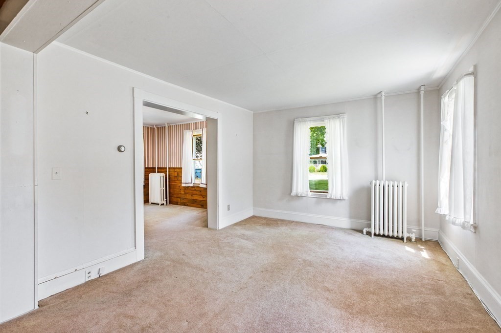 9 Messinger Street Canton, MA 02021 - Photo 16 of 31 an empty room with windows and closet