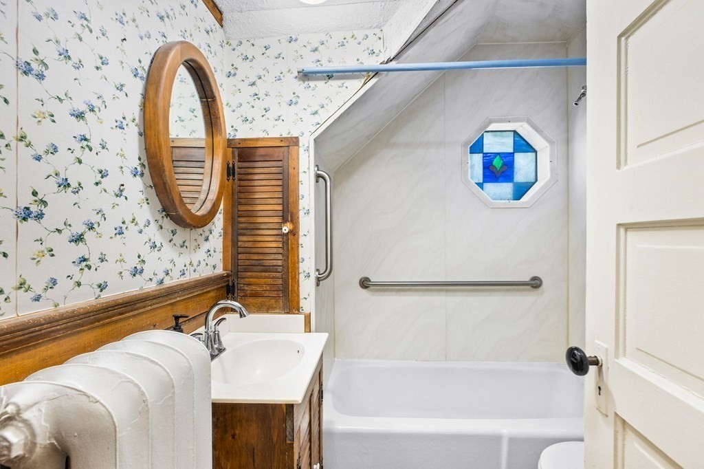 9 Messinger Street Canton, MA 02021 - Photo 24 of 31 a bathroom with a bathtub and a shower