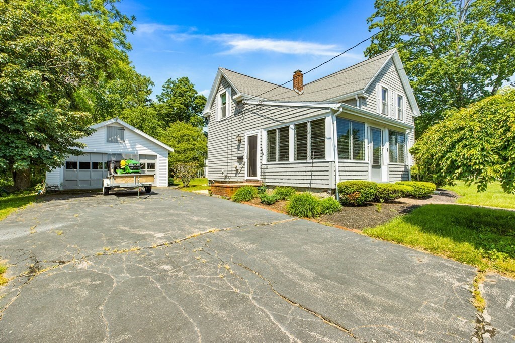 9 Messinger Street Canton, MA 02021 - Photo 3 of 31 a house view with a garden space