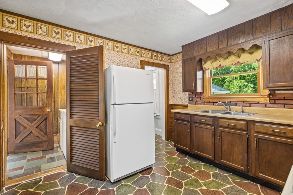 9 Messinger Street Canton, MA 02021 - Photo 6 of 31 a kitchen with a refrigerator and a sink