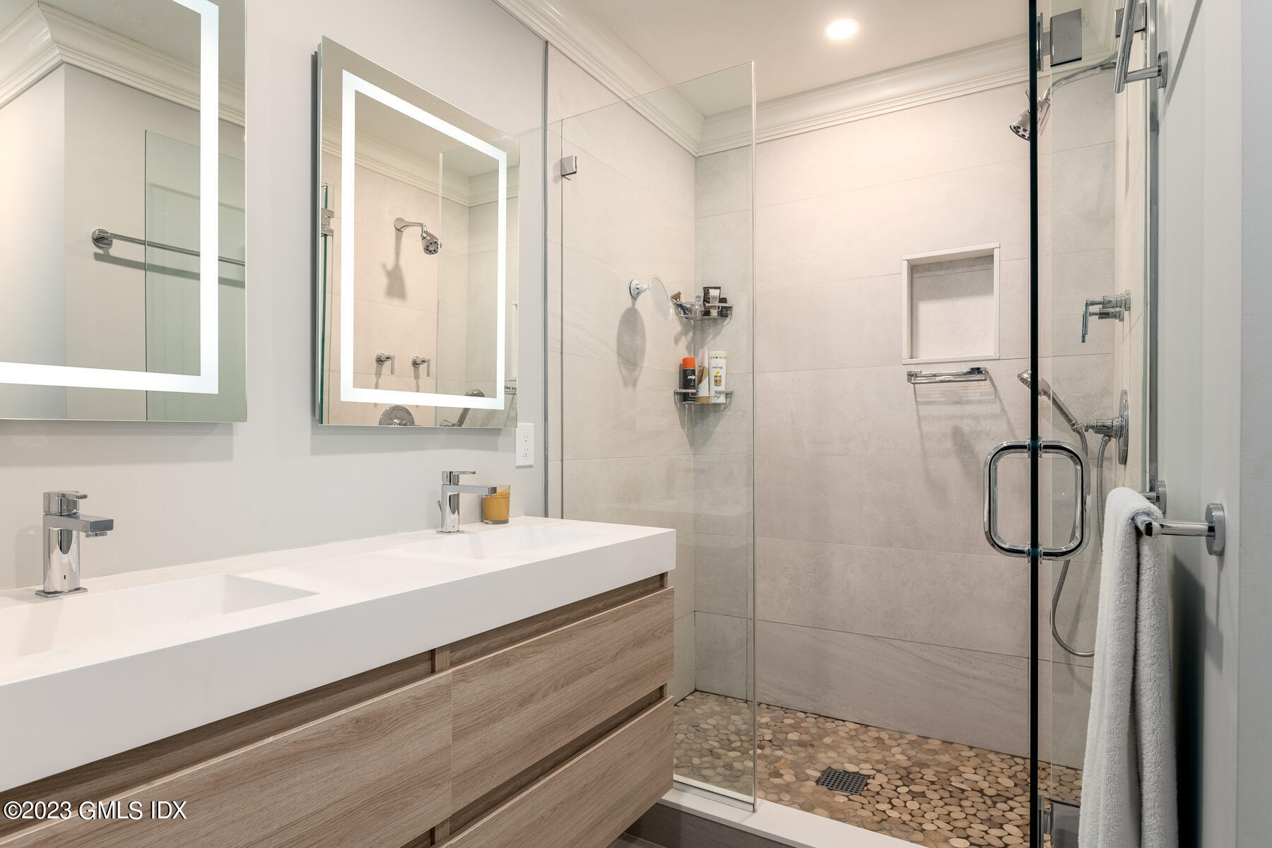 115 River Road, Unit 12 Cos Cob, CT 06807 - Photo 18 of 27 a bathroom with a sink a toilet and shower