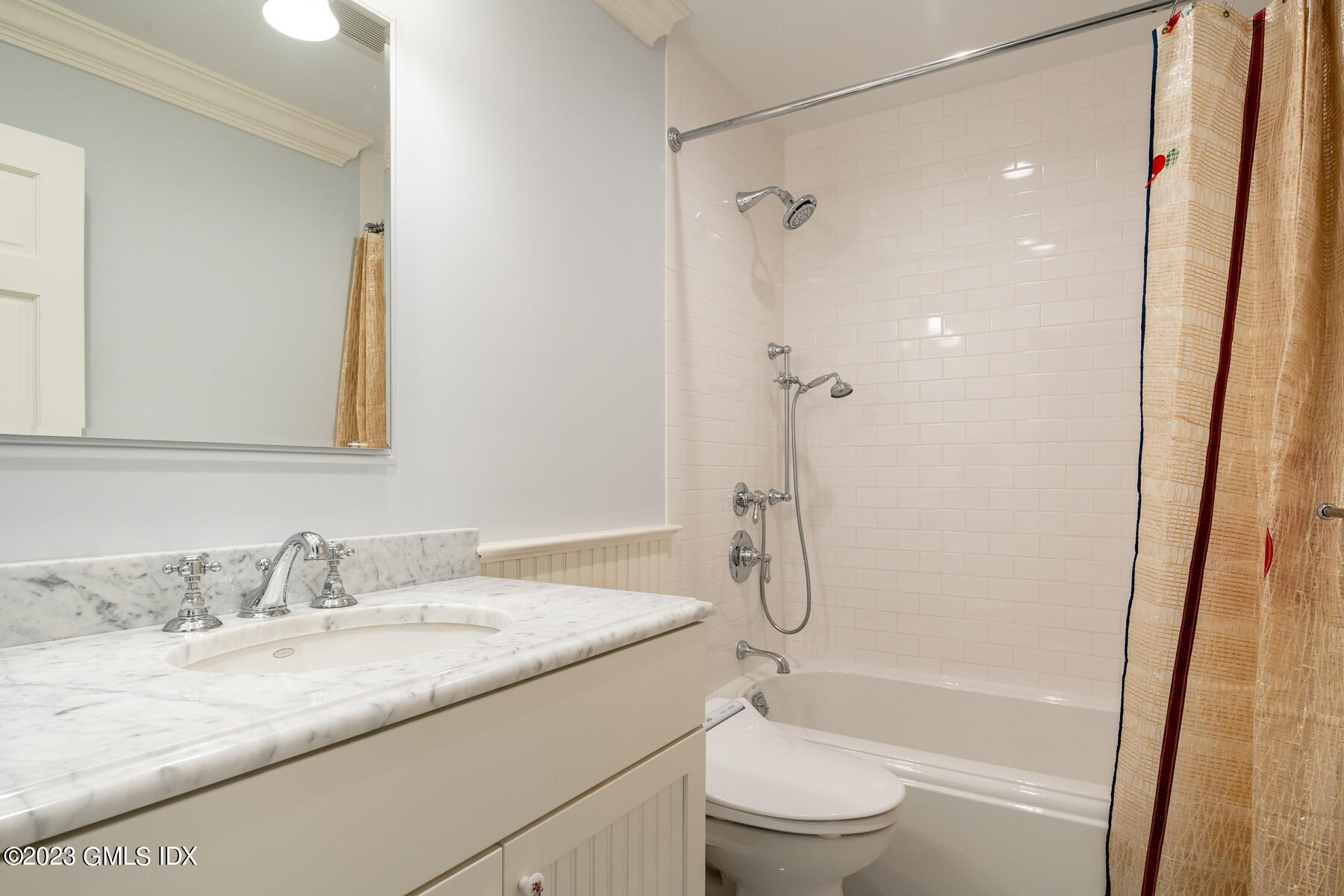 115 River Road, Unit 12 Cos Cob, CT 06807 - Photo 20 of 27 a bathroom with a granite countertop sink toilet and shower