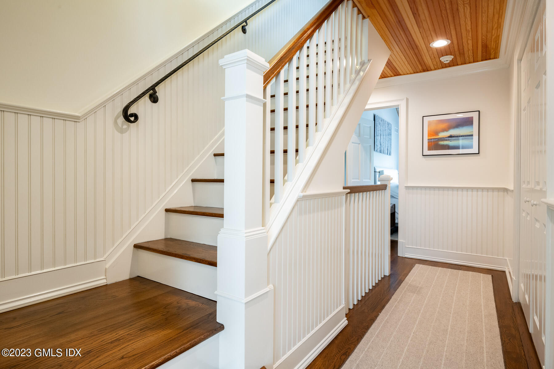115 River Road, Unit 12 Cos Cob, CT 06807 - Photo 21 of 27 a view of staircase with wooden floor and white walls
