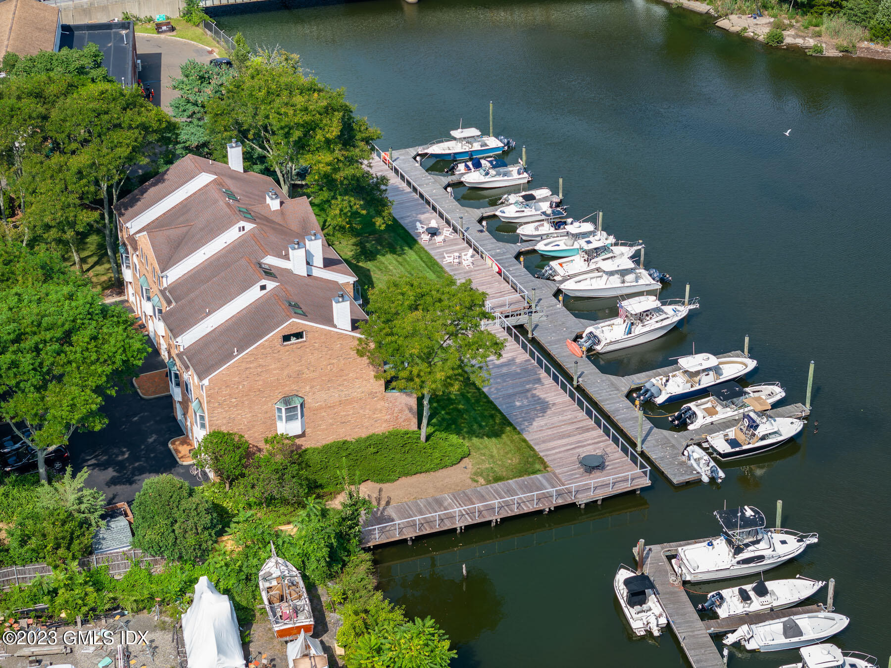 115 River Road, Unit 12 Cos Cob, CT 06807 - Photo 3 of 27 an aerial view of a house with a lake view