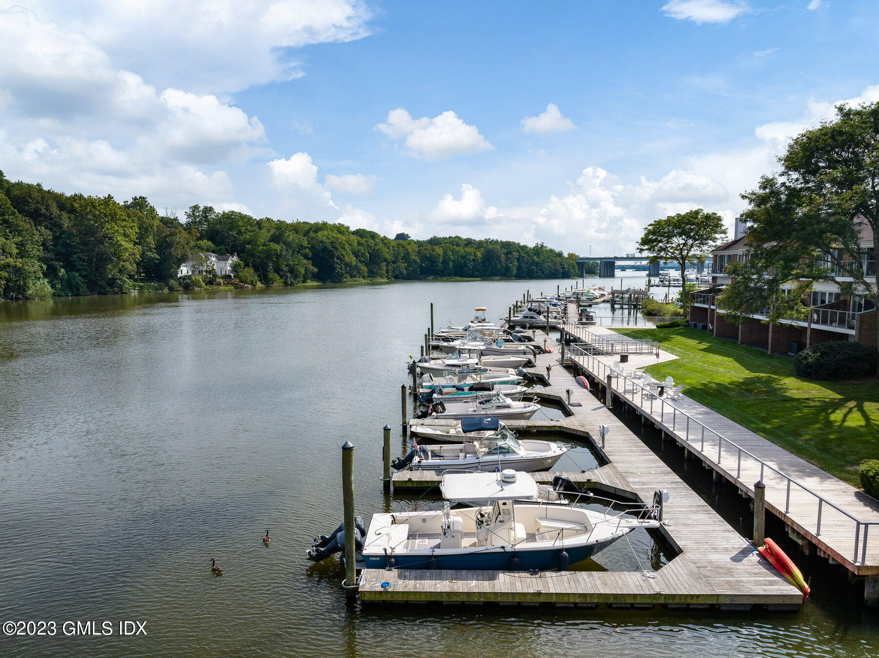115 River Road, Unit 12 Cos Cob, CT 06807 - Photo 5 of 27 a view of a lake with a nearby beach