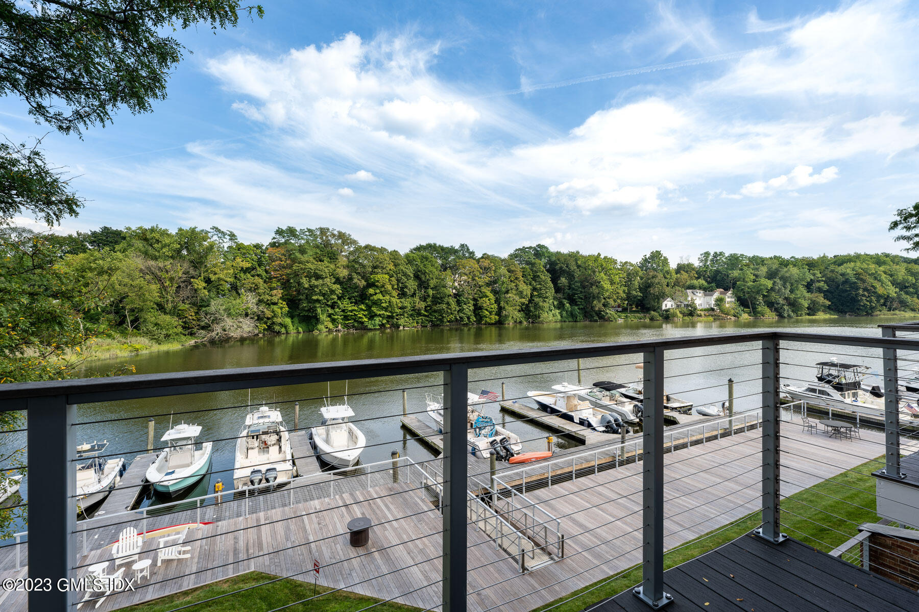 115 River Road, Unit 12 Cos Cob, CT 06807 - Photo 7 of 27 a balcony with wooden floor