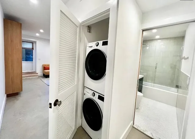 a view of a hallway to a livingroom and a livingroom with furniture