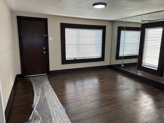 18943 Highway 7 Centerville, TX 75833 - Photo 16 of 33 an empty room with wooden floor and windows