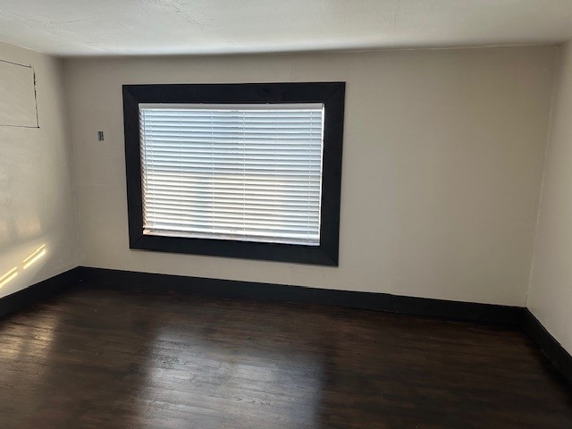 18943 Highway 7 Centerville, TX 75833 - Photo 20 of 33 a view of an empty room with wooden floor and a window