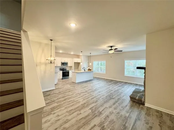 a view of a kitchen with a sink and a stove top oven
