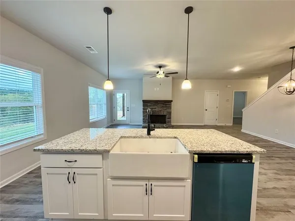 a kitchen with a sink cabinets and window