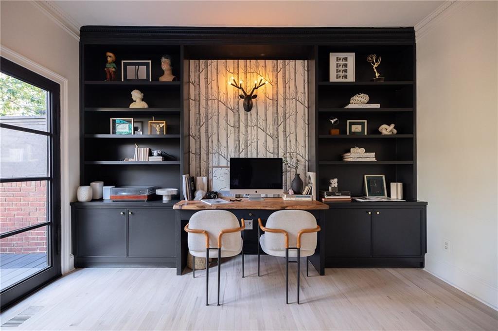 237 Sycamore Place Decatur, GA 30030 - Photo 11 of 52 a living room with furniture a rug and a bookshelf
