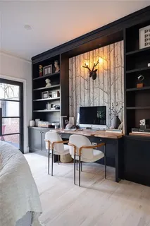 a living room with furniture a rug and a large window