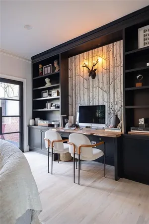 a living room with furniture a rug and a large window