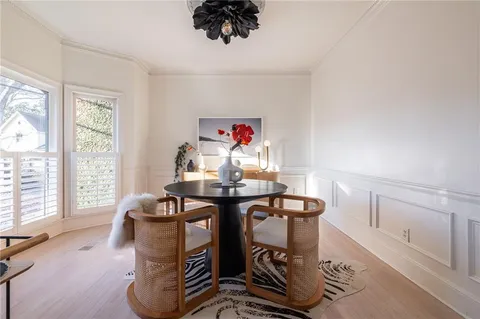 a living room with furniture a window and a chandelier