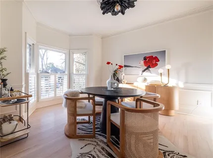 a view of a dining room with furniture window and outside view