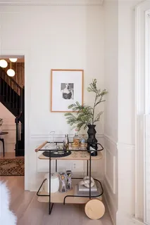 a table with a vase and flowers on it