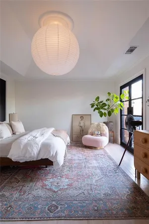 a bed room with a bed and a mirror