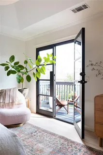 a bedroom with a bed and a mirror