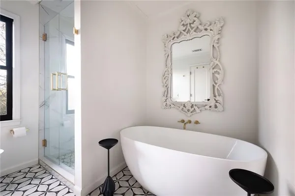 a spacious bedroom with a bed and a table