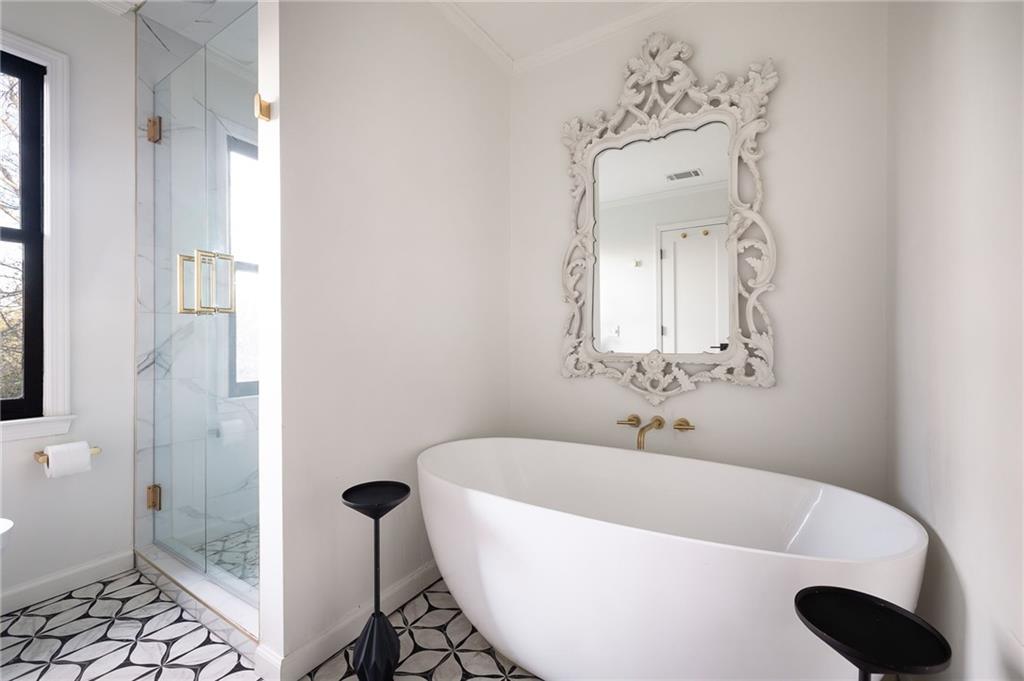 237 Sycamore Place Decatur, GA 30030 - Photo 30 of 52 a white bath tub sitting next to a bathroom sink