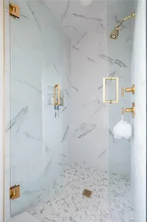 a spacious bedroom with a bed and a large window