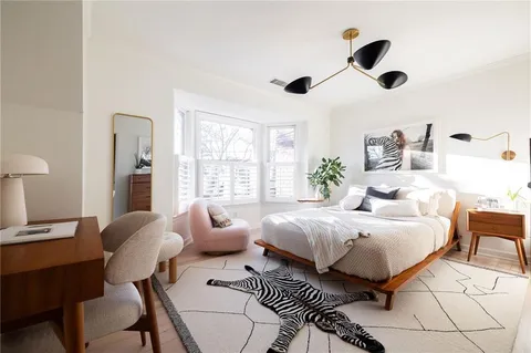 a bedroom with a bed and a table in it