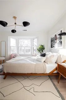 a view of a room with furniture and wooden floor