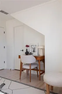 a view of a small space with wooden floor