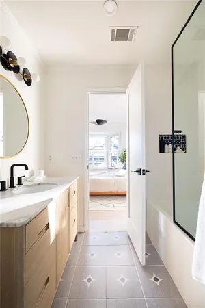 a bedroom with bed and window