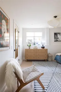 a bathroom with a double vanity sink toilet and shower
