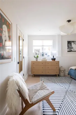a bathroom with a double vanity sink toilet and shower