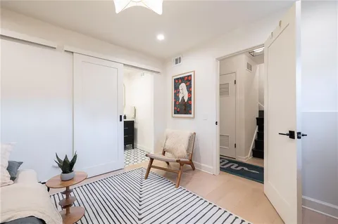 a view of staircase with white walls and a window