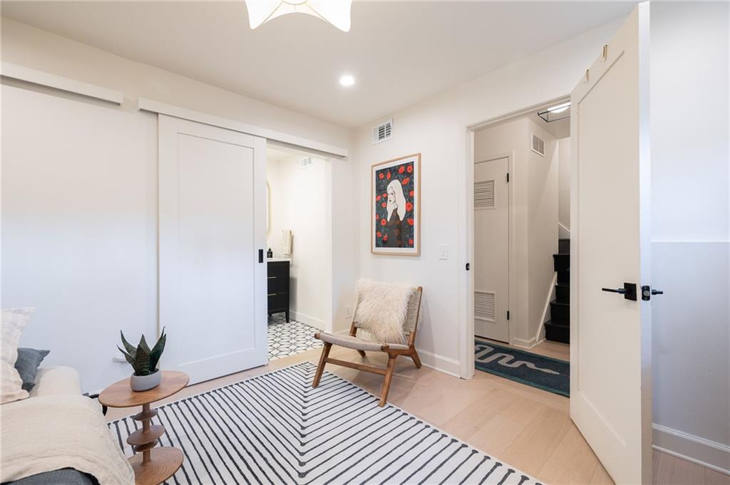 237 Sycamore Place Decatur, GA 30030 - Photo 44 of 52 a living room with furniture a rug and a window