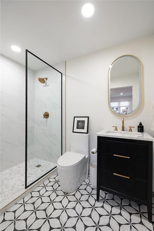 237 Sycamore Place Decatur, GA 30030 - Photo 45 of 52 a spacious bathroom with a toilet a sink and mirror