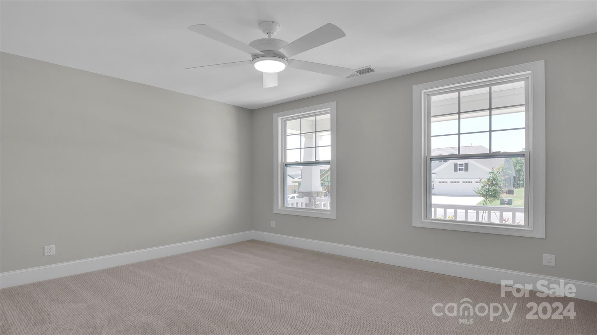 3053 Trace Meadow York, SC 29745 - Photo 11 of 28 an empty room with windows and fan