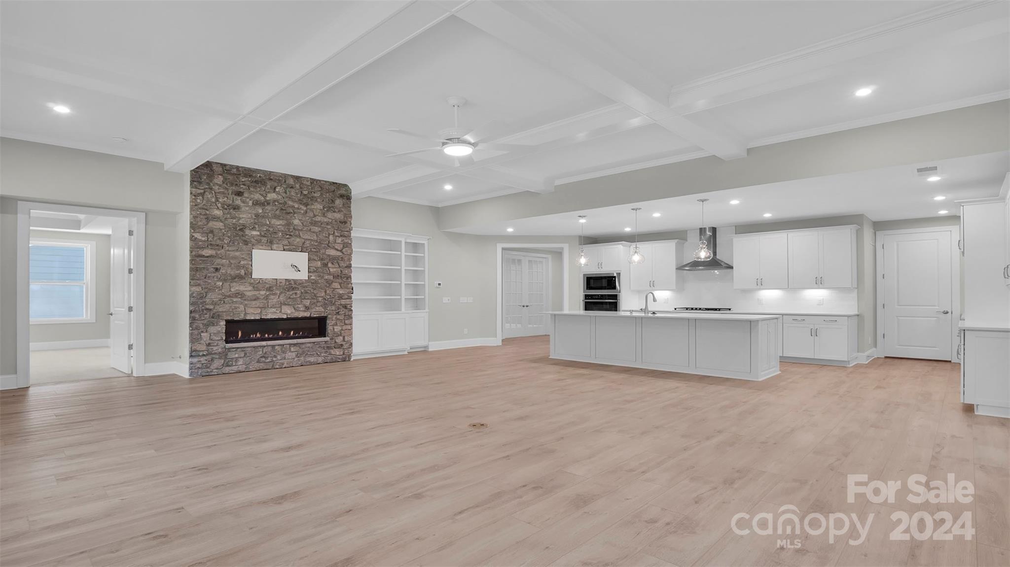 3053 Trace Meadow York, SC 29745 - Photo 17 of 28 a view of kitchen with kitchen island and stainless steel appliances with living room view
