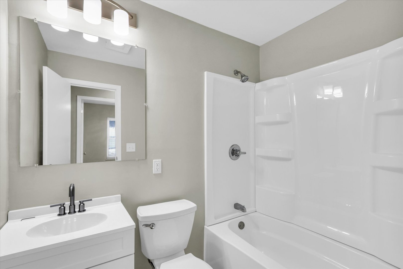 2808 Carrelton Drive Champaign, IL 61821 - Photo 13 of 24 a bathroom with a bathtub shower sink vanity and toilet