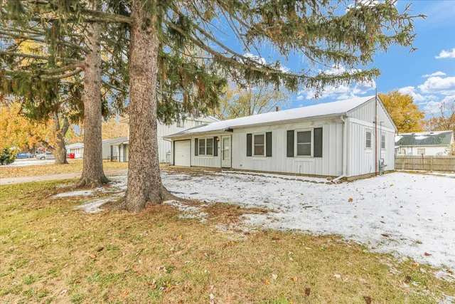 a backyard of a house with large trees