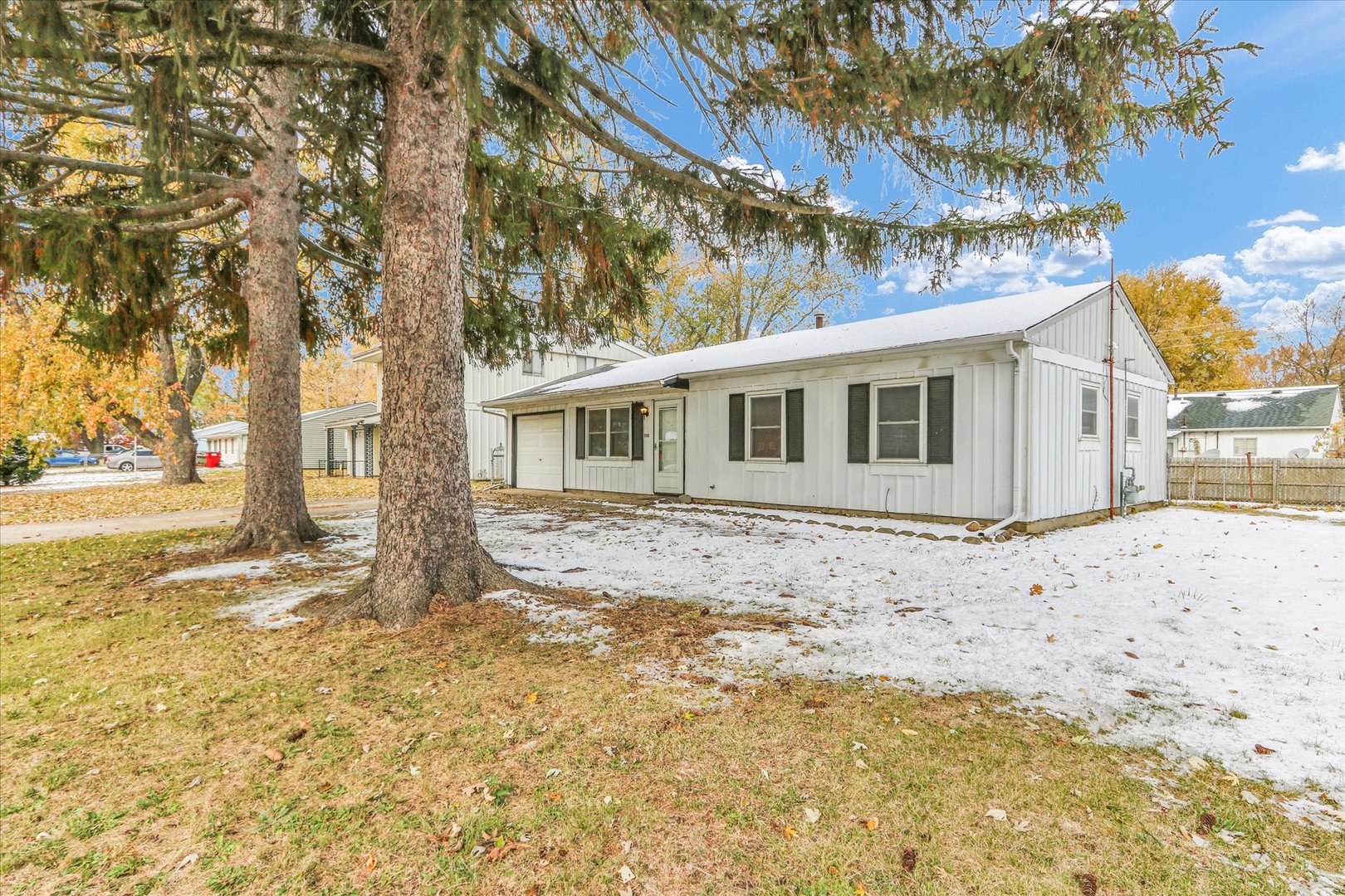 2808 Carrelton Drive Champaign, IL 61821 - Photo 3 of 24 a backyard of a house with large trees