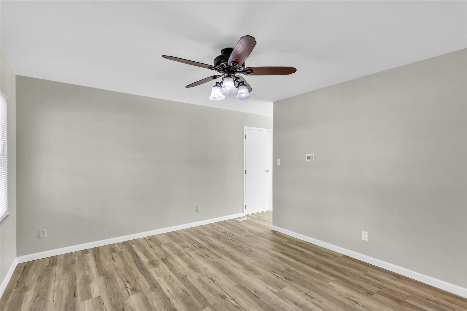 2808 Carrelton Drive Champaign, IL 61821 - Photo 4 of 24 a view of an empty room with a window