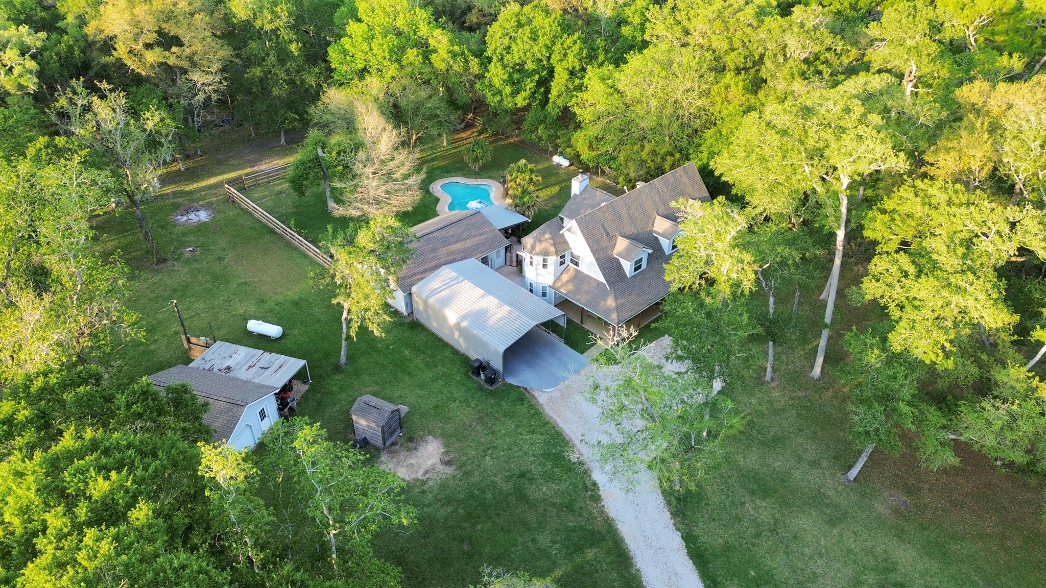 20202 Deer Run Road Damon, TX 77430 - Photo 43 of 45 an aerial view of residential house with outdoor space and trees all around