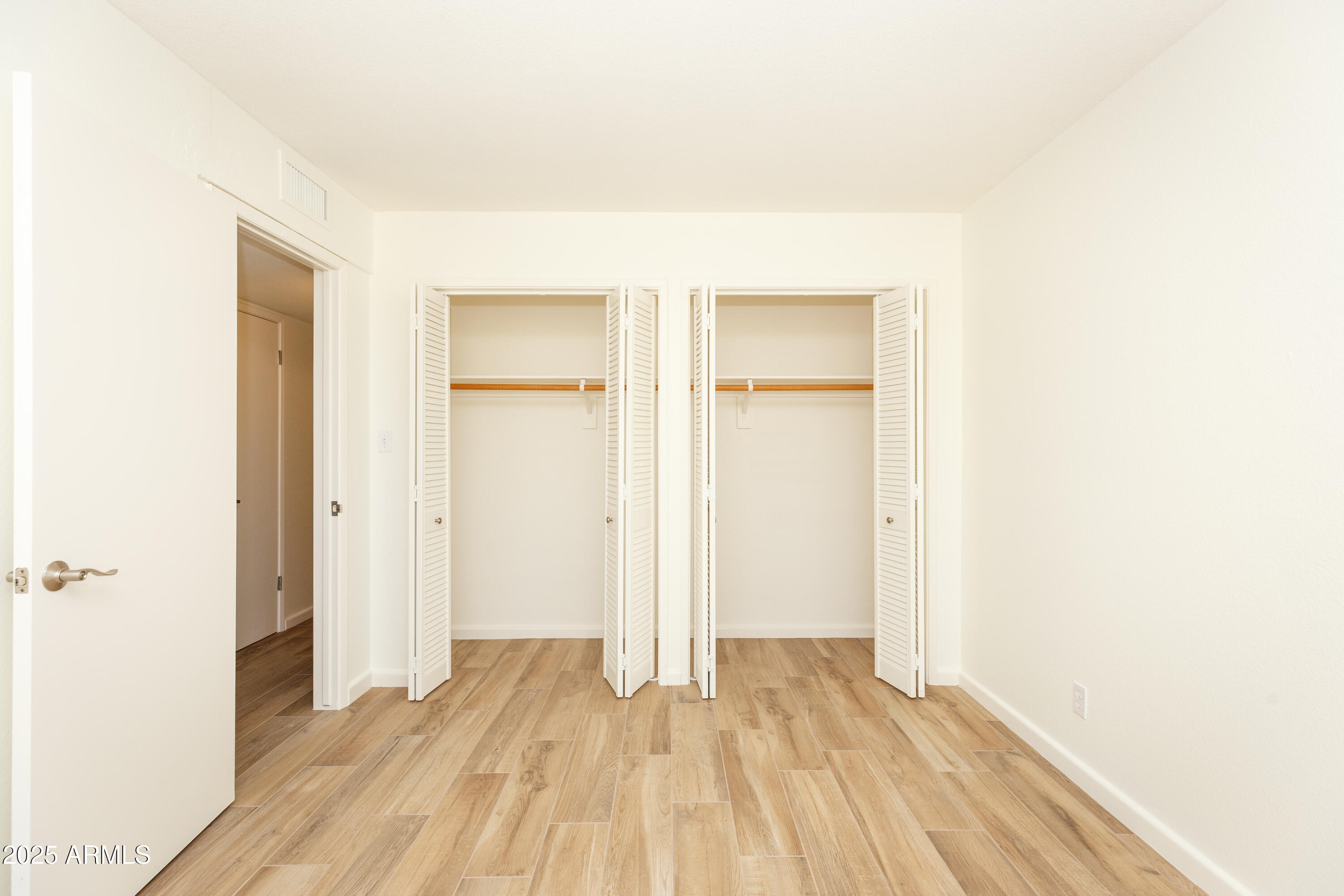 7401 North Scottsdale Road, Unit 51 Paradise Valley, AZ 85253 - Photo 6 of 12 a view of a room with wooden floor