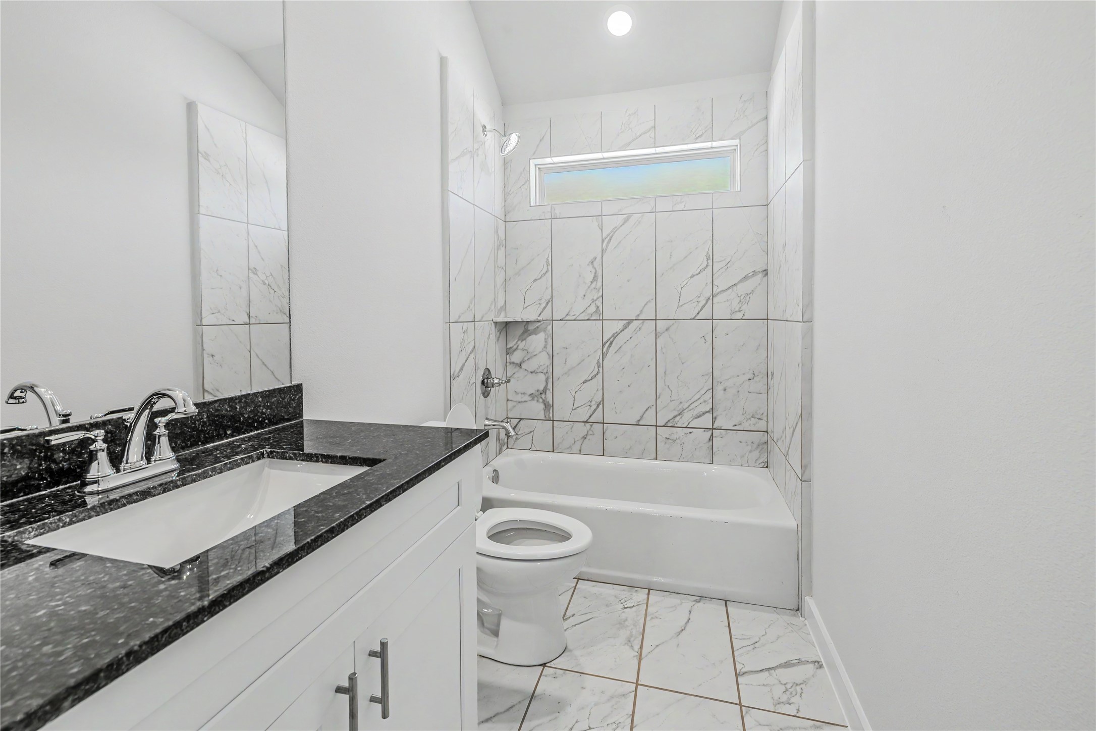 6426 Bolinas Court Rosharon, TX 77583 - Photo 39 of 49 a bathroom with a granite countertop sink a toilet and bathtub