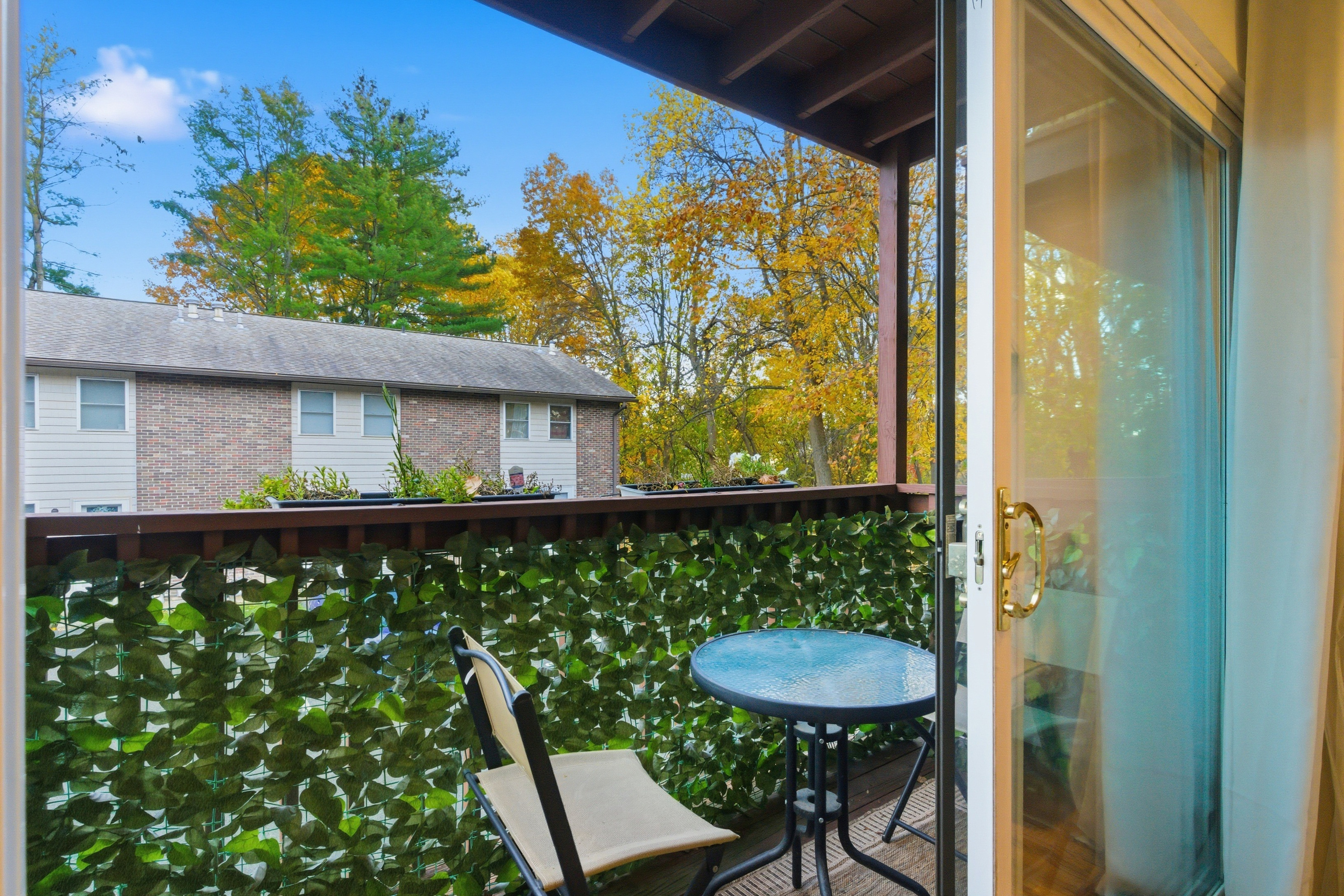382 Knapps Highway, Unit 382 Fairfield, CT 06825 - Photo 11 of 22 a view of a chair and table in the balcony