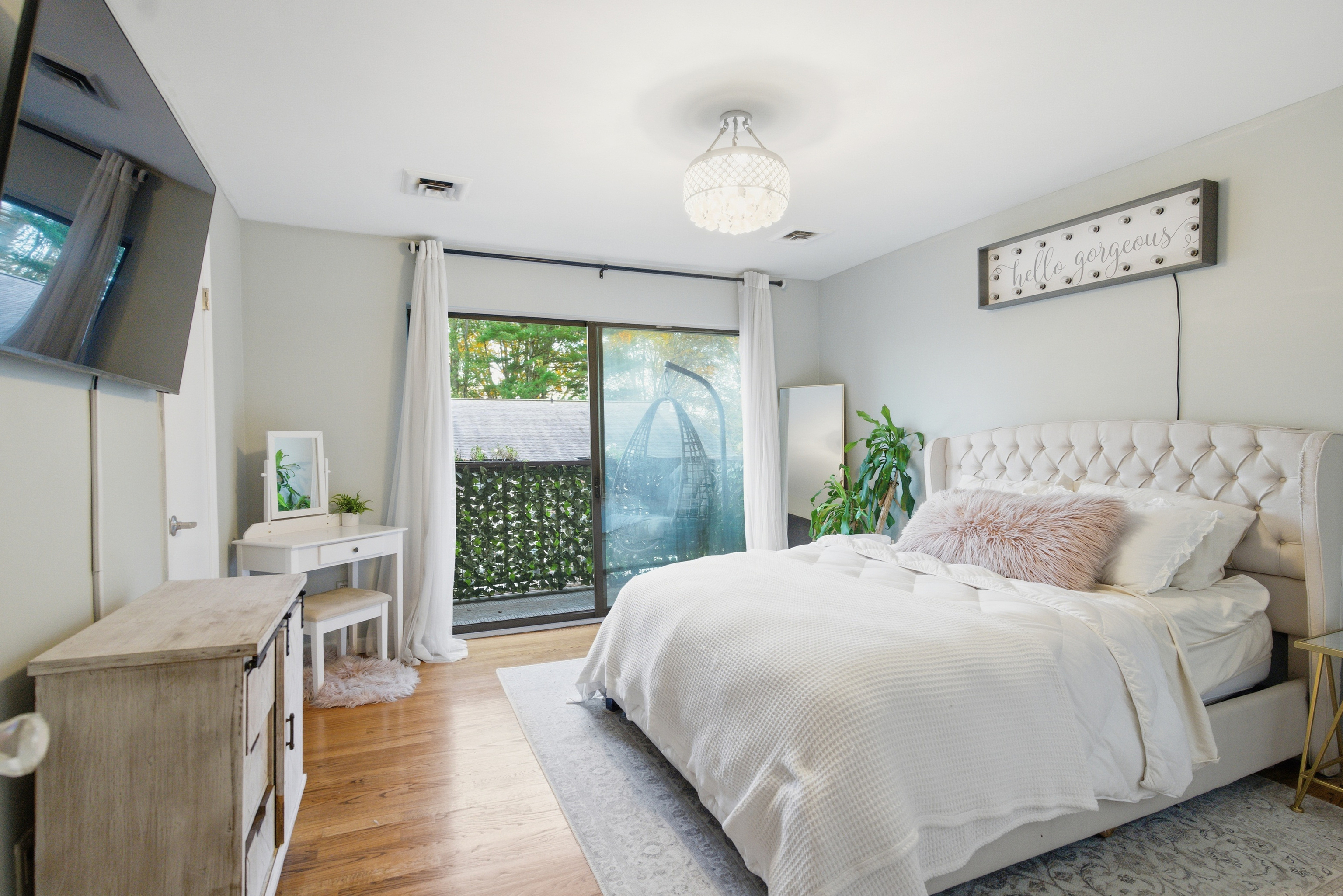 382 Knapps Highway, Unit 382 Fairfield, CT 06825 - Photo 12 of 22 a bedroom with a large bed and a flat tv screen