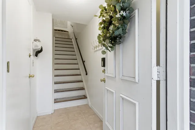 a view of entryway with wooden floor